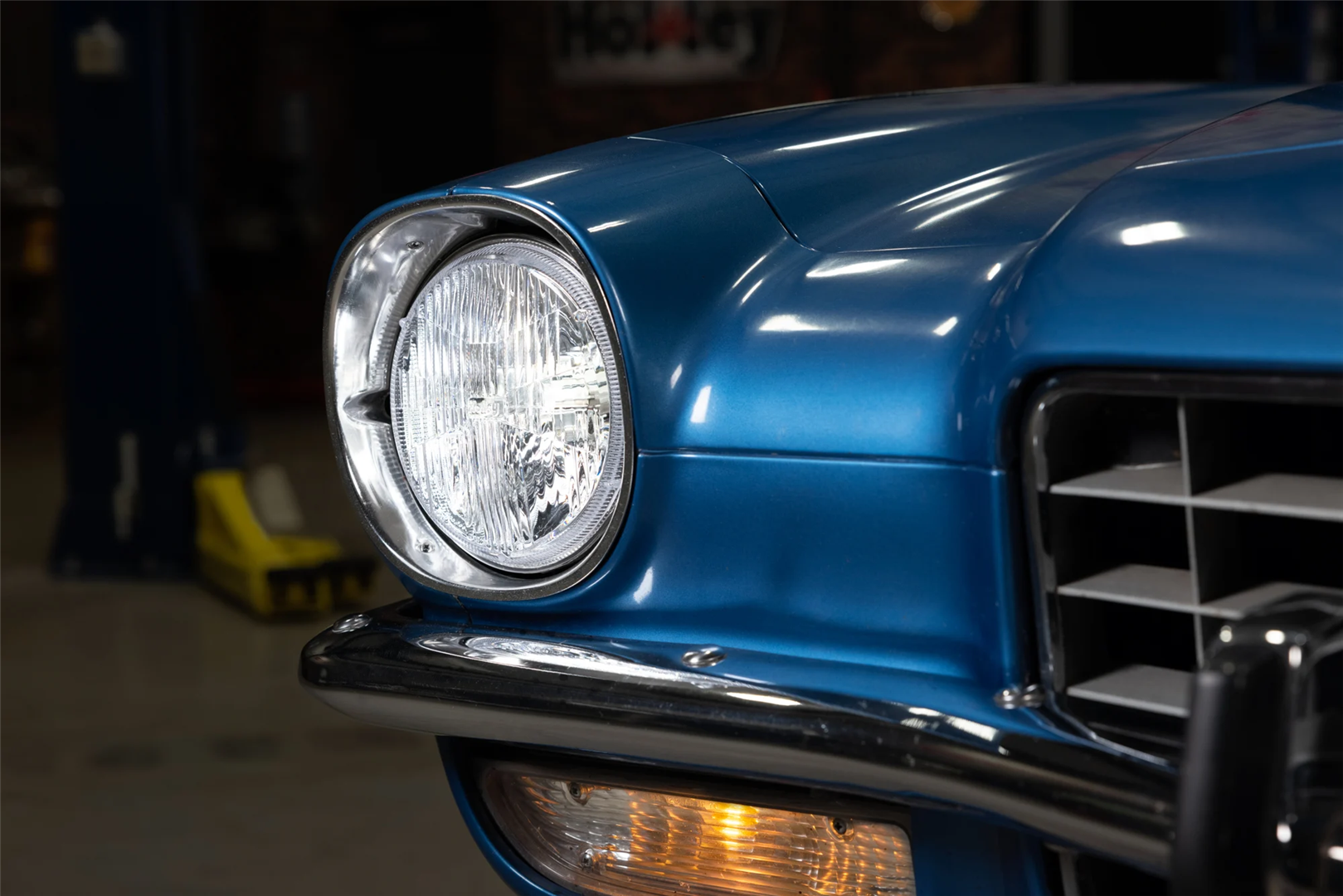 Blue classic car upclose to RetroBright headlights